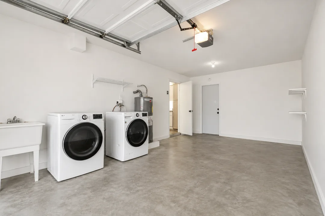A cleared, swept-out garage with usable floor space after a cleanout in the Phoenix area